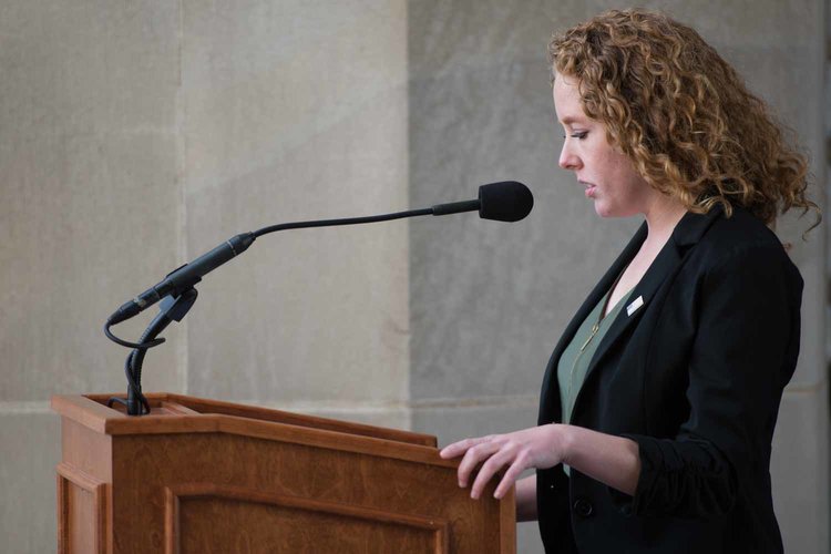 Abigail Eckerly speaking at a lectern.