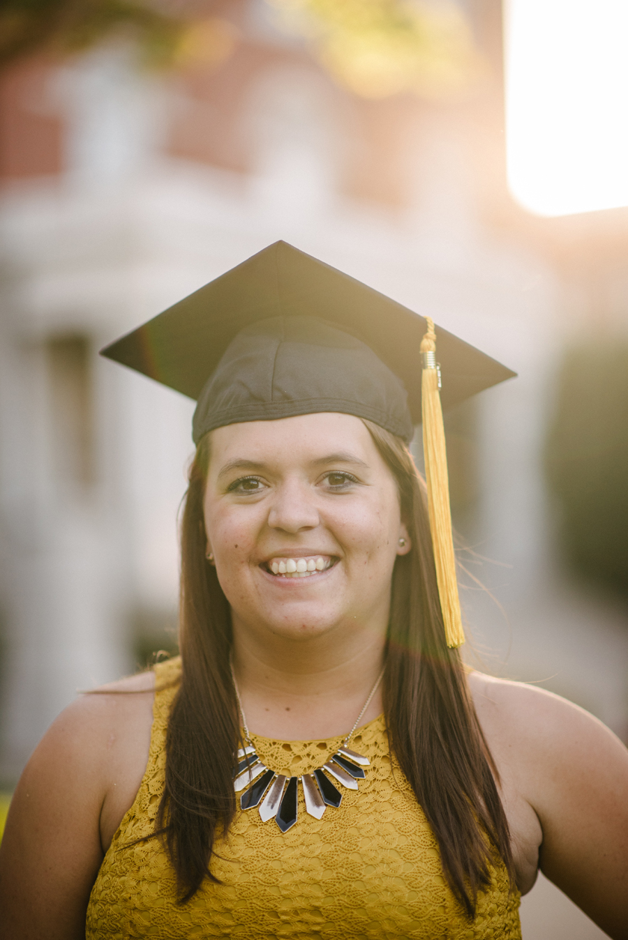Kendra Holaday in graduation cap.