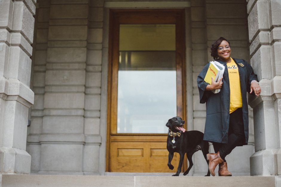 Jada Winchester and her dog on the steps of Jesse Hall