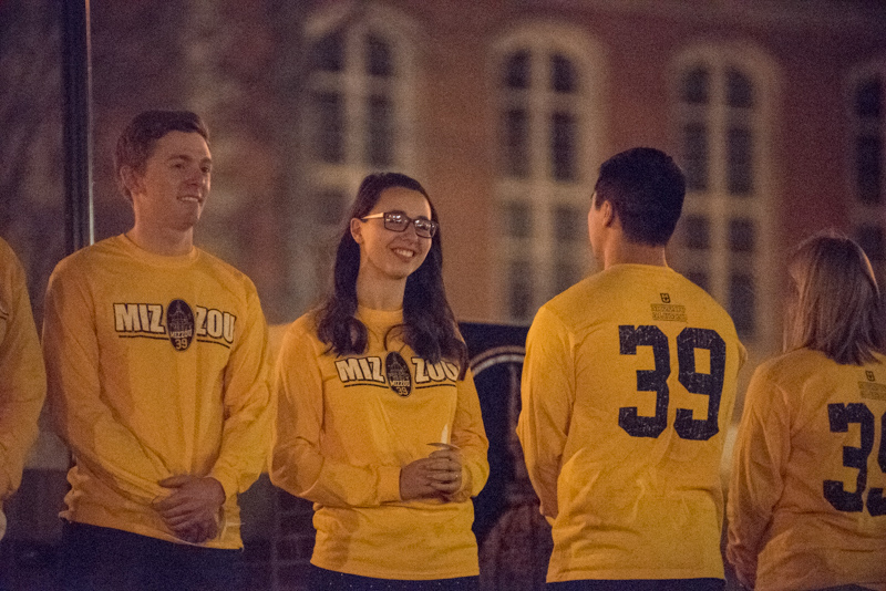 Students in '39' shirts at dusk.