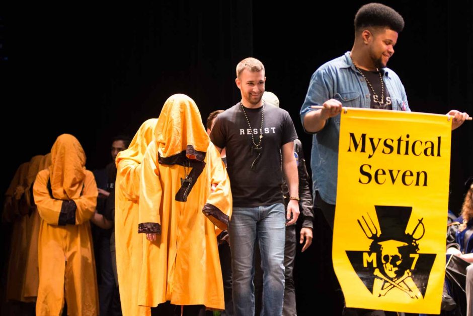 Dariun Wu, right, and Cole Lawson lead new members of Mytical Seven on to the stage.