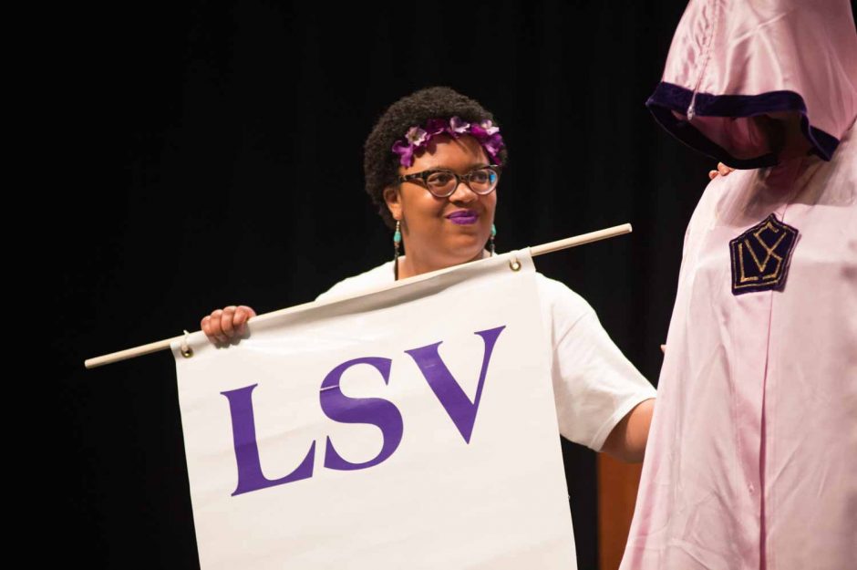 Sequoyah Moore leads the newest members of LSV across the stage. 