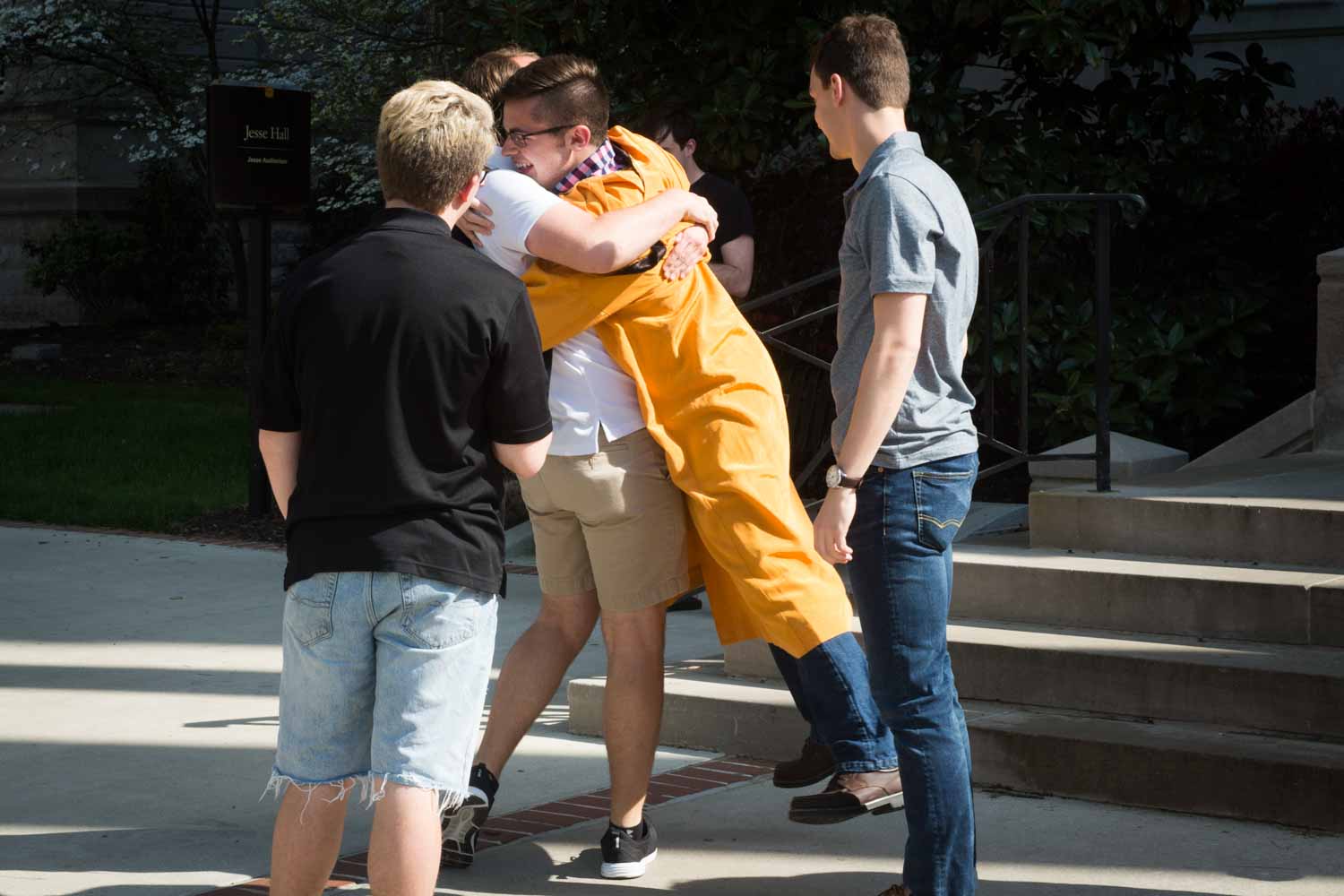 Jake Boeding receives a celebratory hug from a friend after leaving Jesse Hall.