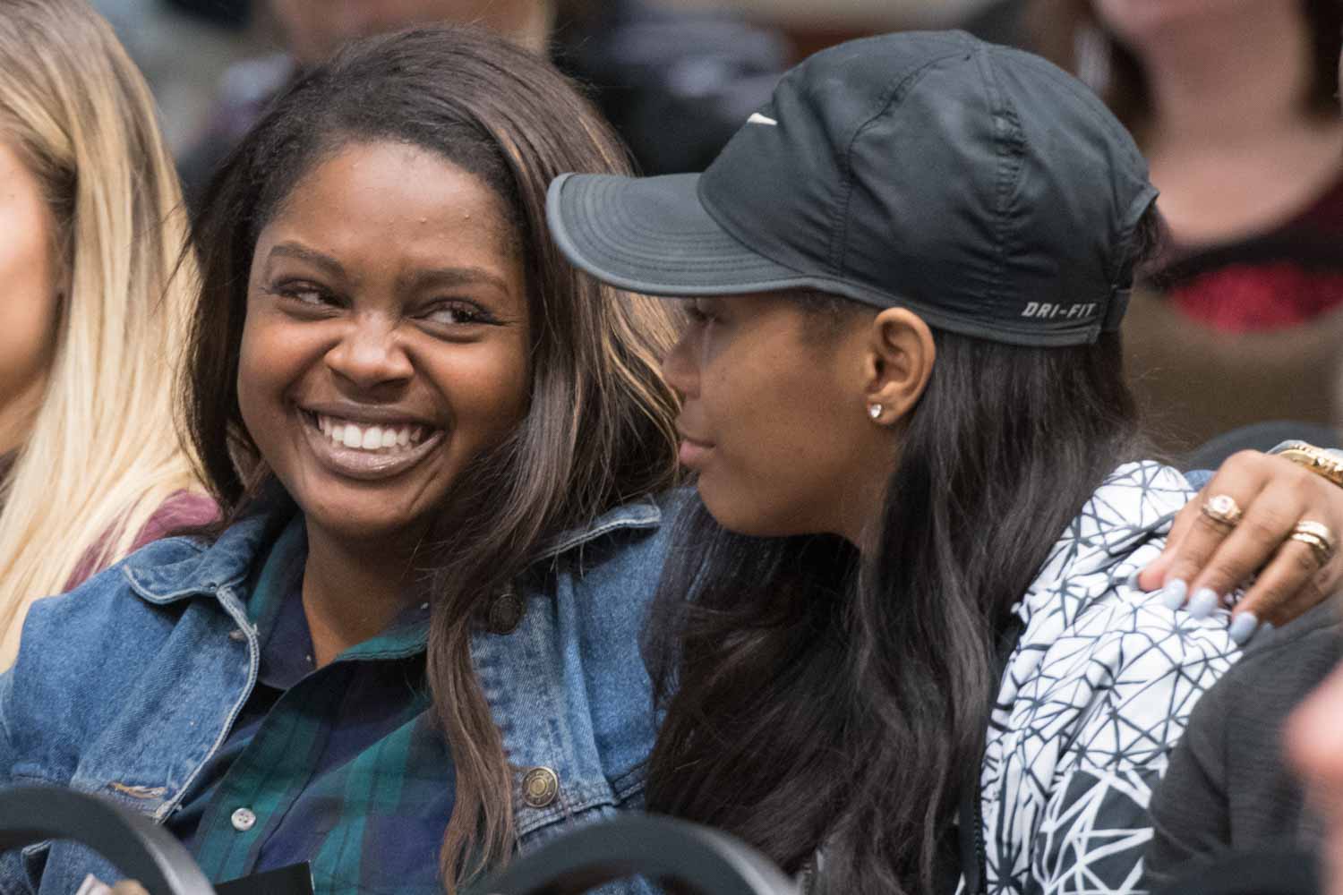 Robbie Hatchett, left, shares a smile with her friend, Raven Smith, who both attended the event in honor of Dariana Byone.