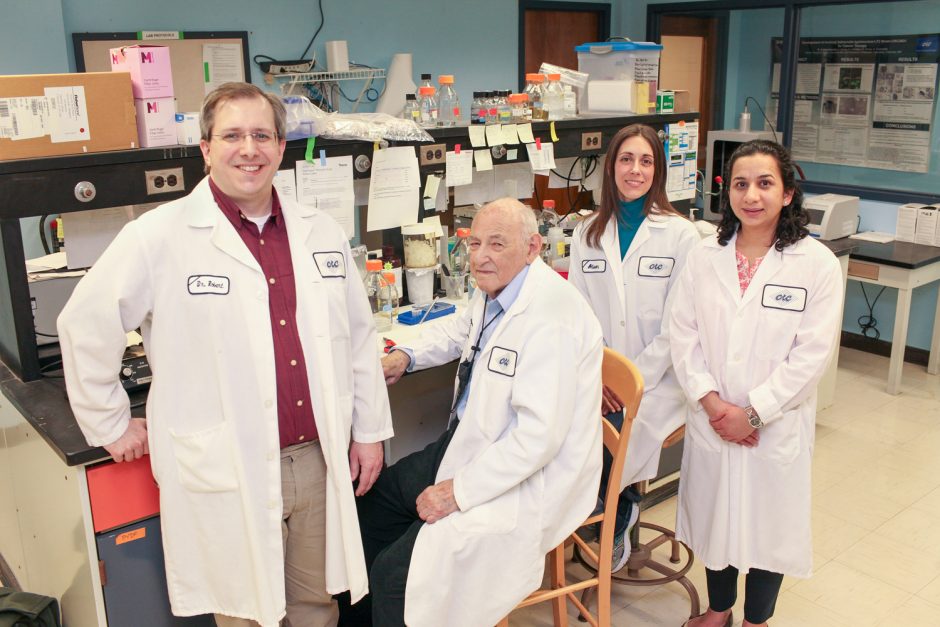 Group photo of researchers in lab coats.