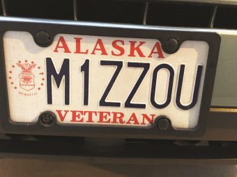 Alaska license plate that says "M1ZZOU"