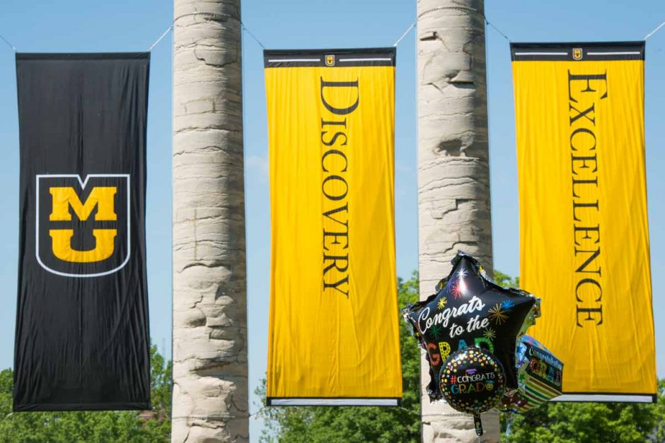 Graduation balloons with Discovery and Excellence banners.