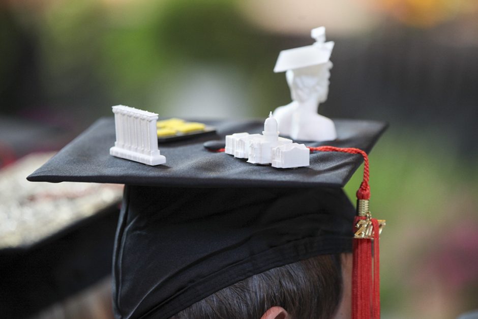 Cap with tiny 3D-printed bust of a graduate, columns and Jesse Hall glued to top.