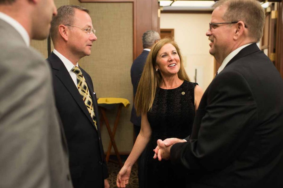 Cartwright meets Columbia's mayor, Brian Treece, and his wife Mary Phillips after the press conference ends. 