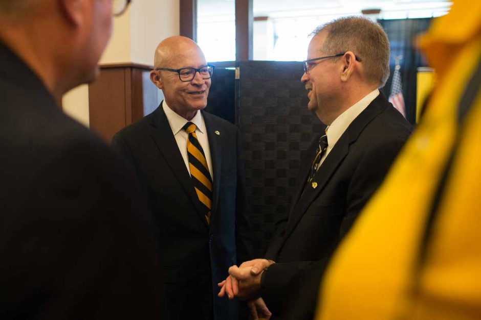 Chancellor Alex Cartwright speaks with former interim President Michael Middleton during the reception. 
