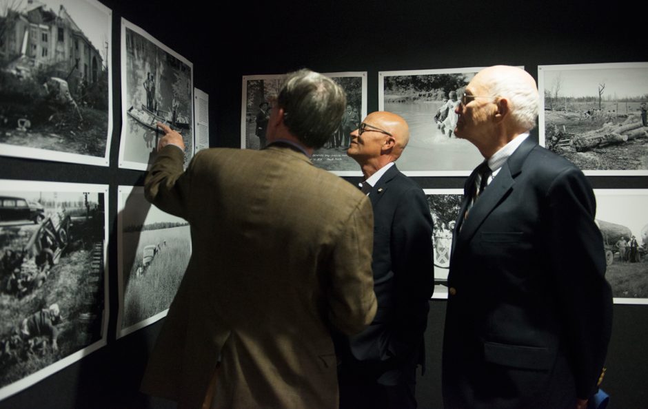Berkley, Hudson, Jim Turner and Mike Middleton looking at old photographs.