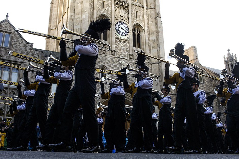 The Marching Mizzou trombone section marches in uniform past Memorial Union.