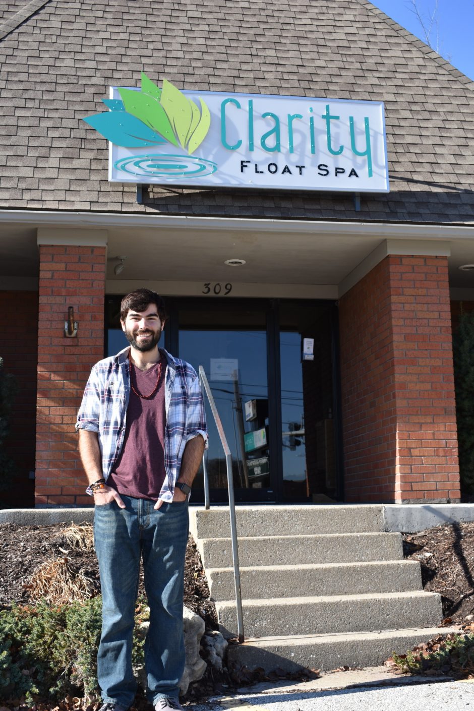 Picture of Connor Knabe standing in front of Clarity Float Spa in downtown Columbia