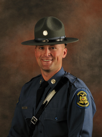 Picture of Travis Inman in his old Highway Patrol uniform