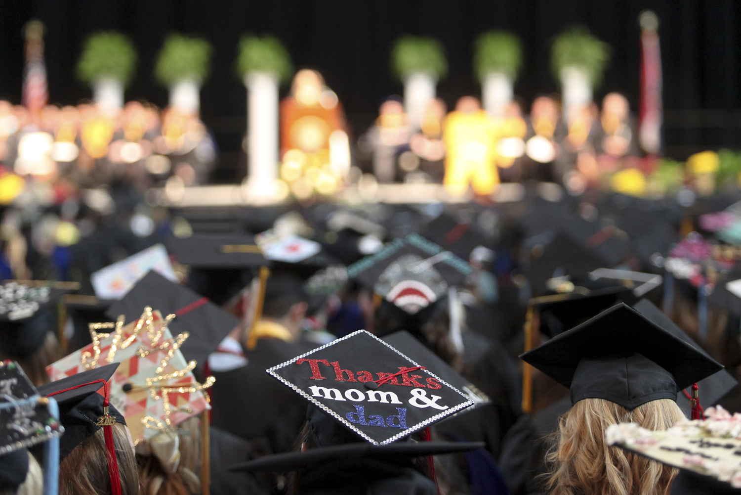 A message to parents decorates the top of a mortar board during a prior Honors Convocation. Photo by Rob Hill.