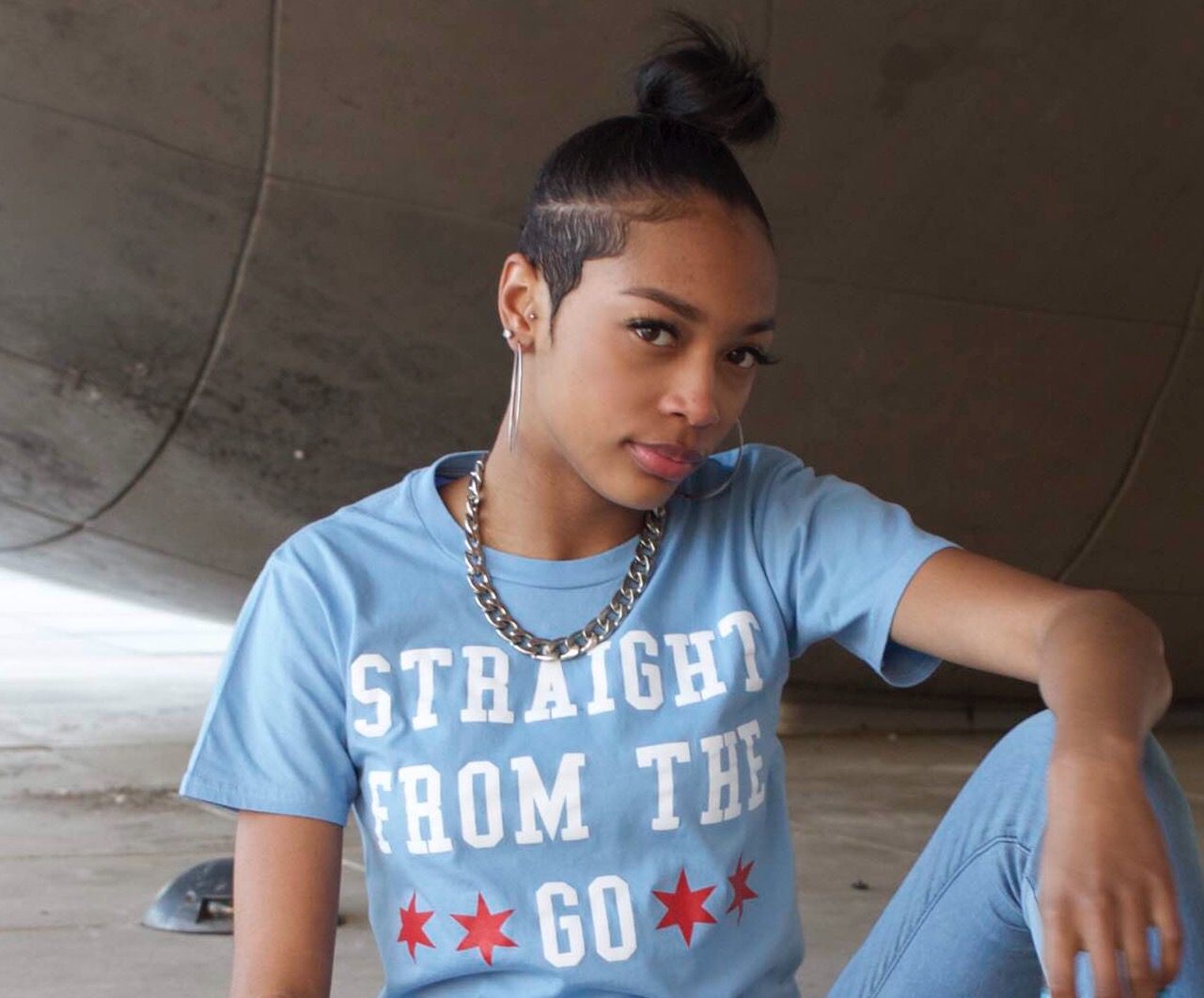 Picture of Raven Smith in front of the Bean in Chicago wearing a "Straight from the Go" shirt