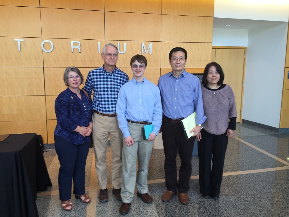 Picture of Eric Prullage and his parents and Dr. Zhang and his wife. 