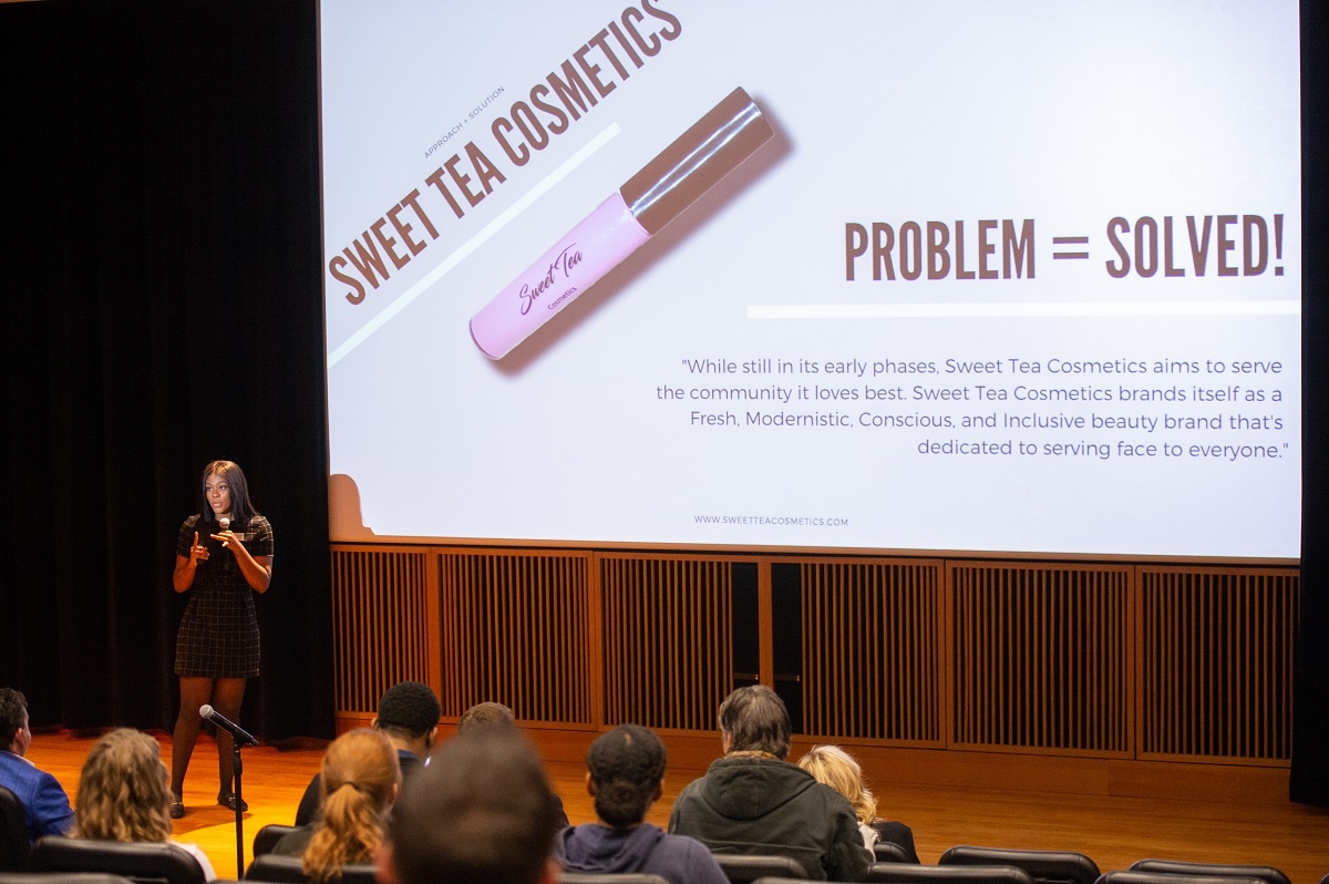This is a picture of Teanna Bass pitching her business at the EQ pitch competition