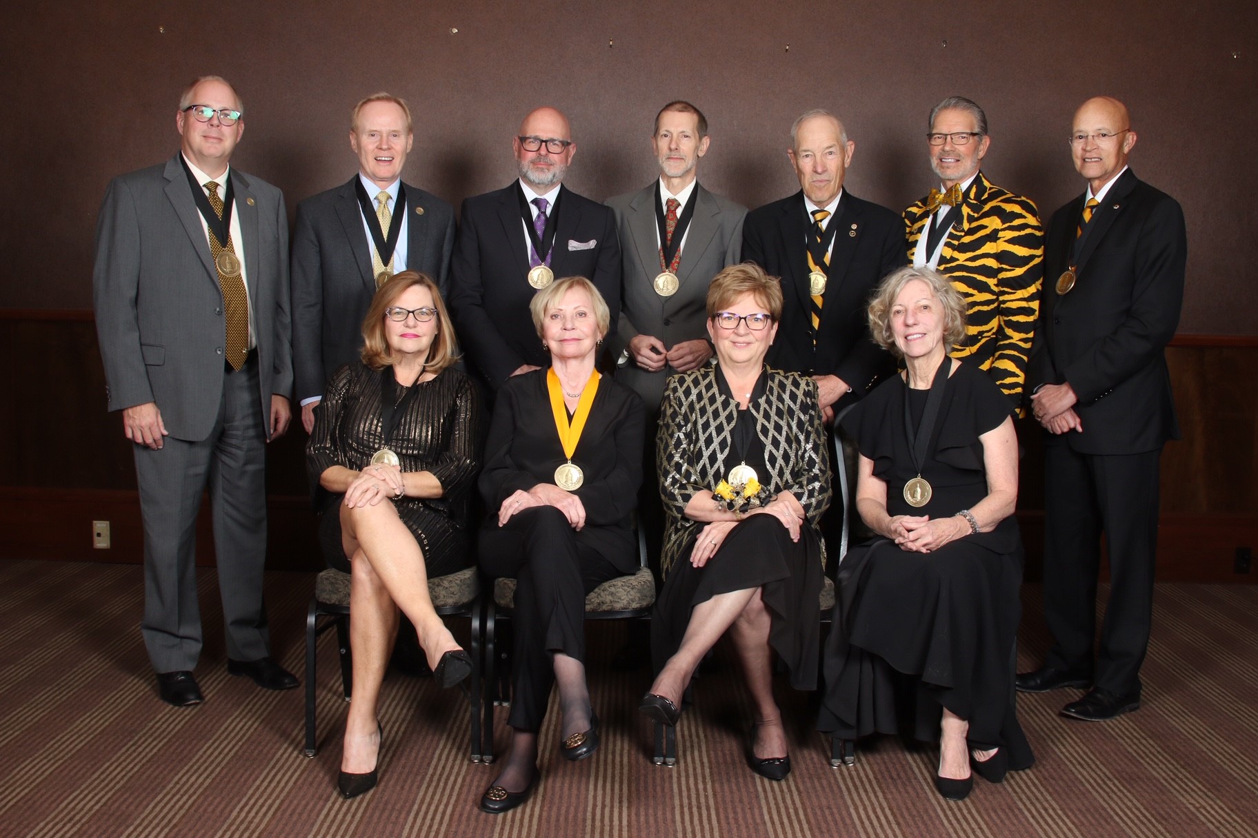 The Mizzou Alumni Association honored 12 distinguished faculty and alumni on Nov. 15. Honorees include (top row from left to right) J.D. Bowers, William Corrigan Jr., Scott Woelfel, Peter Vallentyne, Robert Banning, John Qualy and Michael Middleton. (front row left to right) Angela Drake, Margaret Duffy, Susan Donnell Scott and Jeanne Abbott. Thomas Lafferre not pictured. 