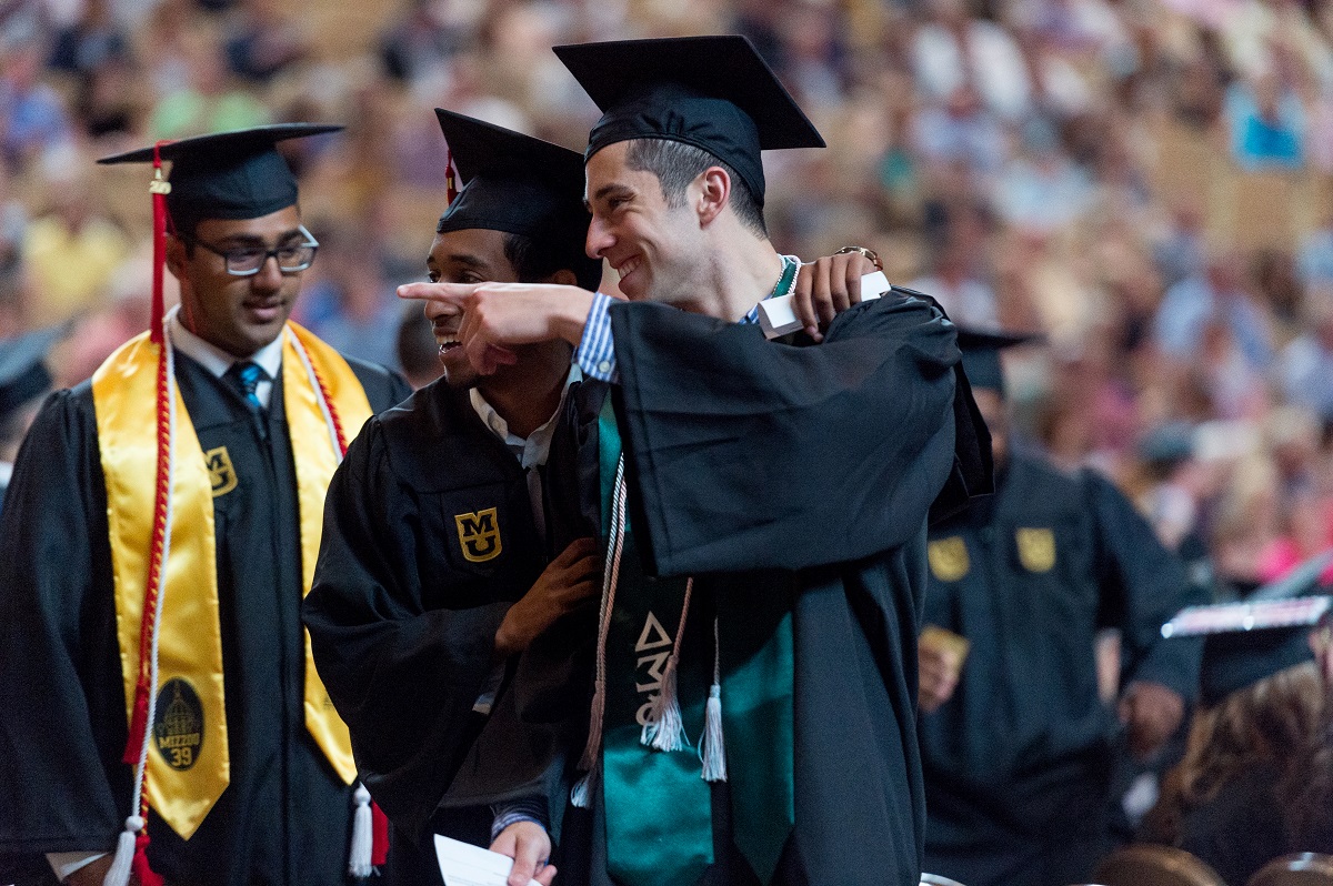 Mizzou students celebrating during a commencement ceremony. 