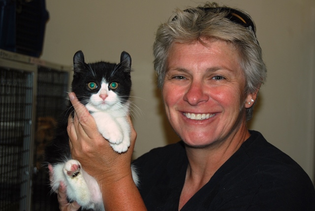 This is a photo of Leslie Lyons and a cat