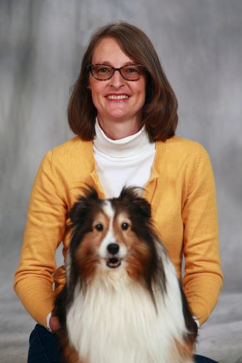 This is a photo of Dr. Carlisle and Mira the dog.