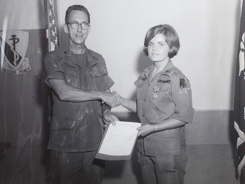 Capt. Fritz receives her second U.S. Army commendation medal from Col. Cochran in 1970.
