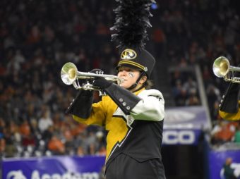 This is a picture of Brianne O'Sullivan playing trumpet in Marching Mizzou